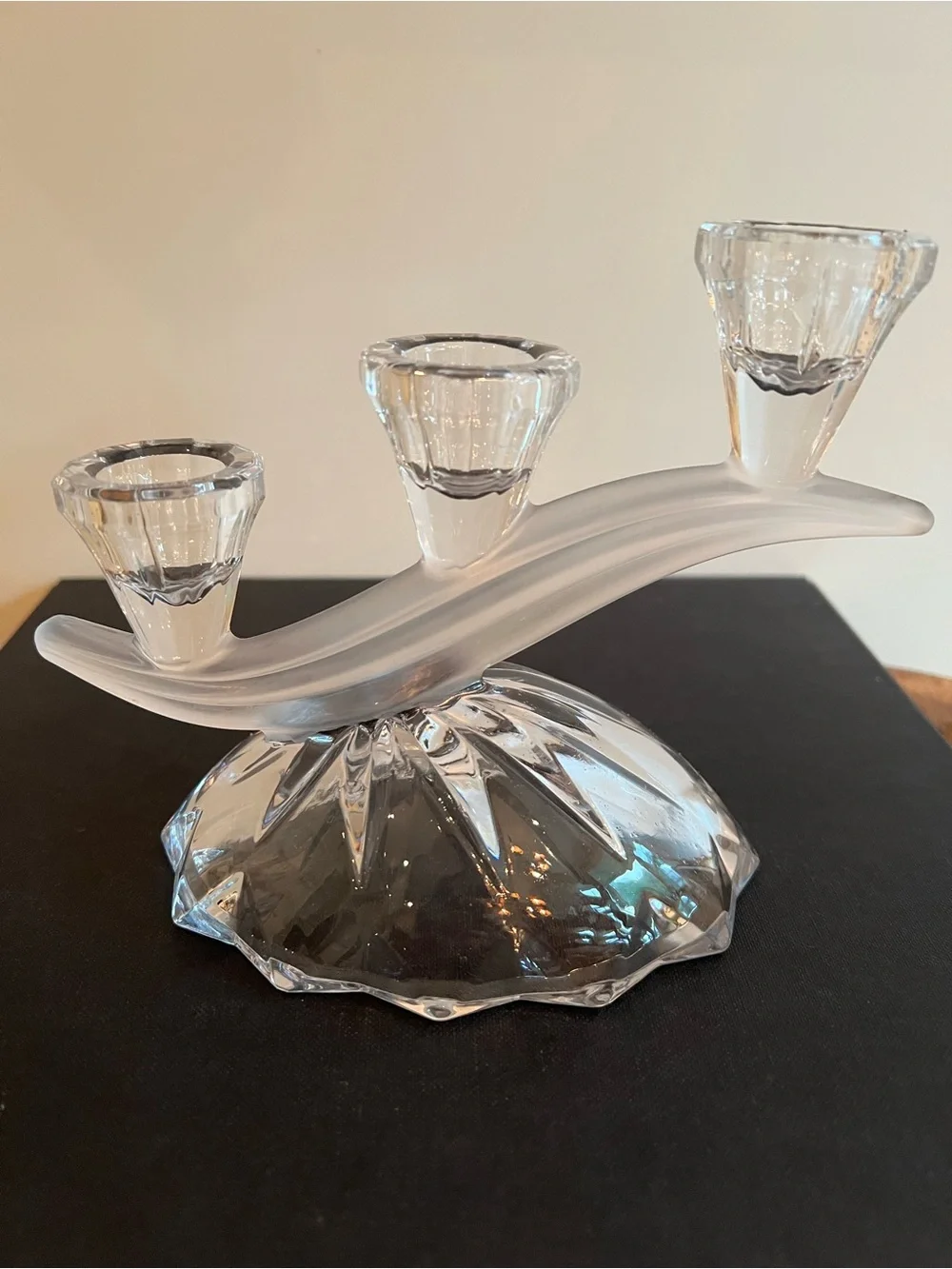 Glass candle holder Features a unique asymmetrical 